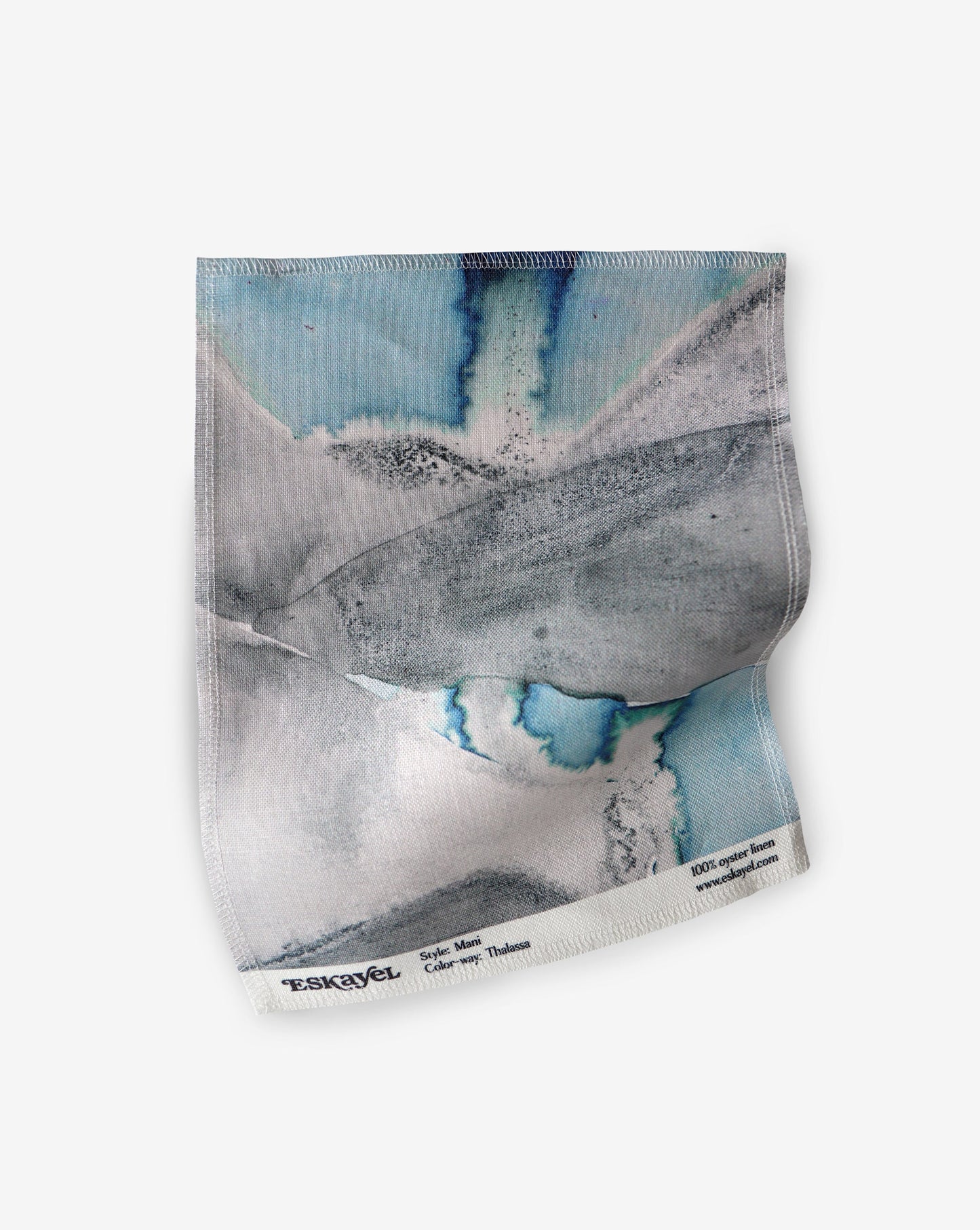 A blue and white Mani Fabric Thalassa design from Greece adorns this hand fabric, inspired by the beautiful Mani Peninsula