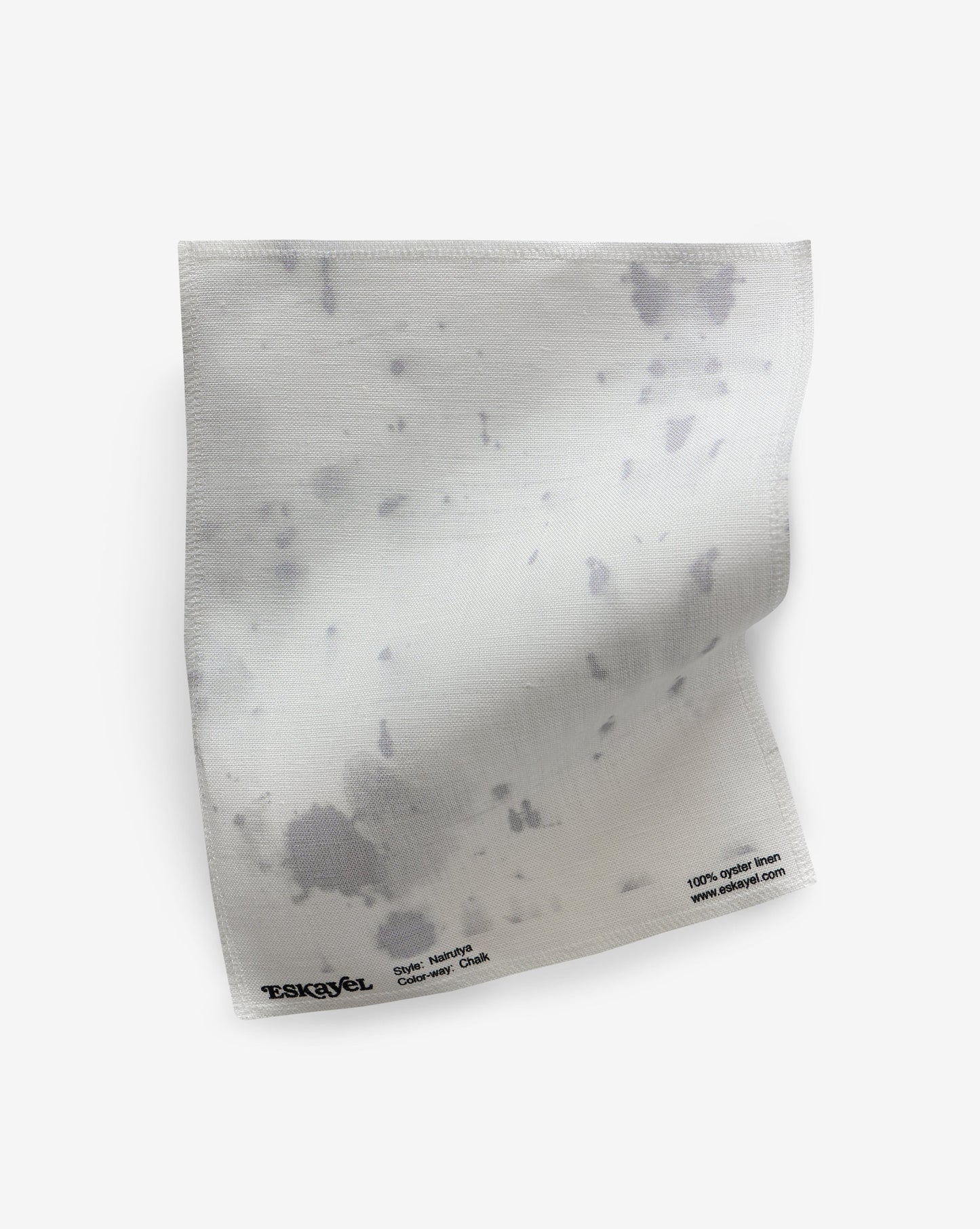 a sample of a Nairutya Fabric Sample Chalk with black splotches on it