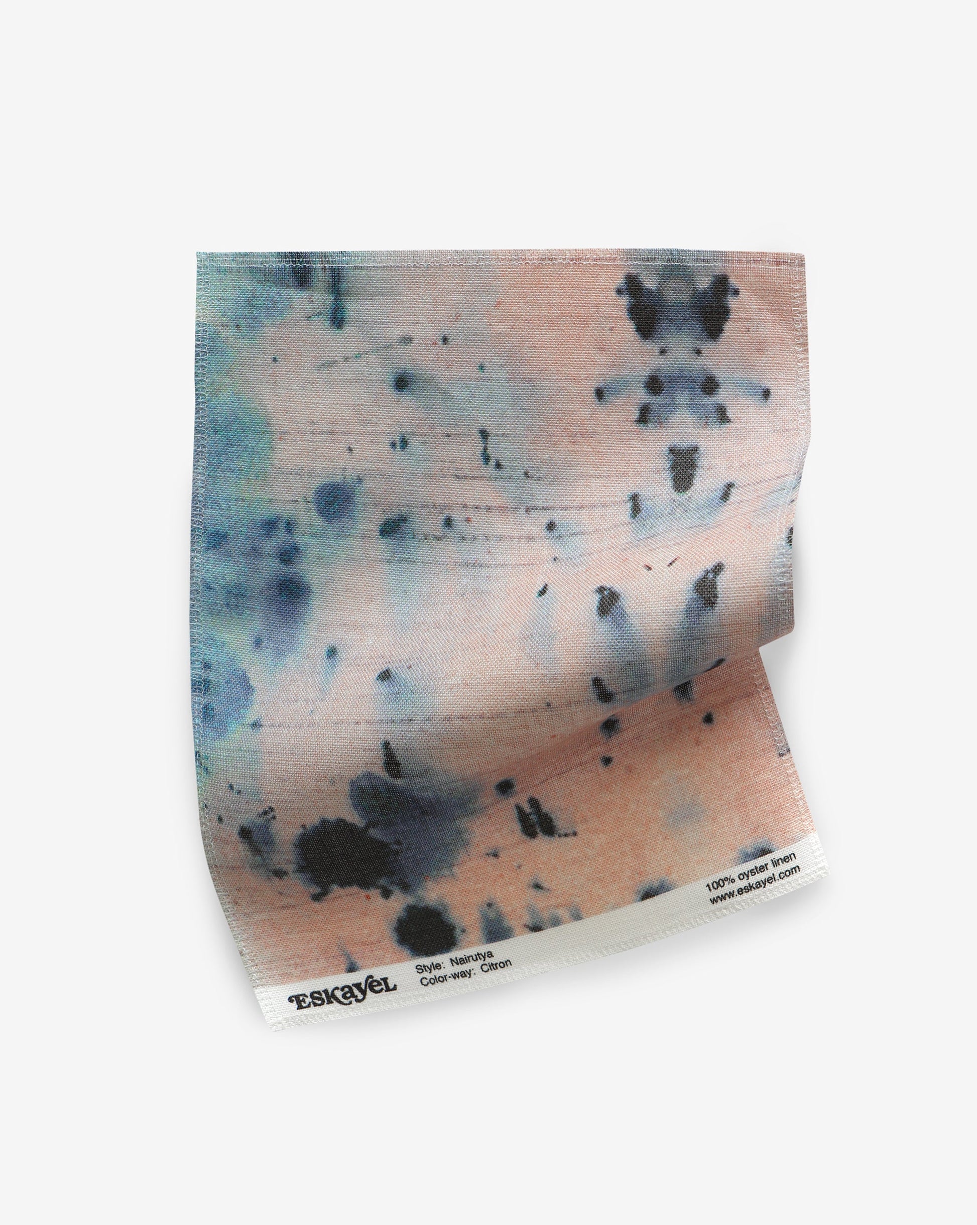 A Nairutya Fabric Sample Citron piece of paper with blue and pink paint on it
