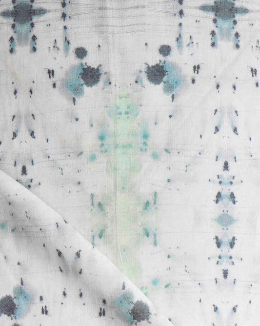 A close up of a blue and green tie dyed Nyanza fabric