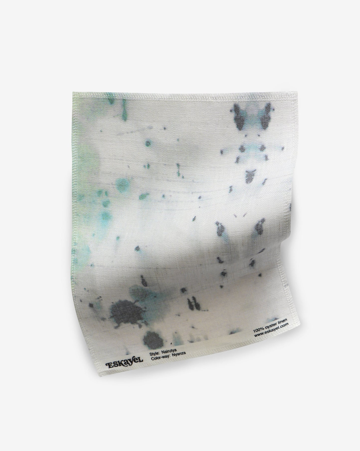 A Nairutya Fabric Sample Nyanza with ink splatters on it