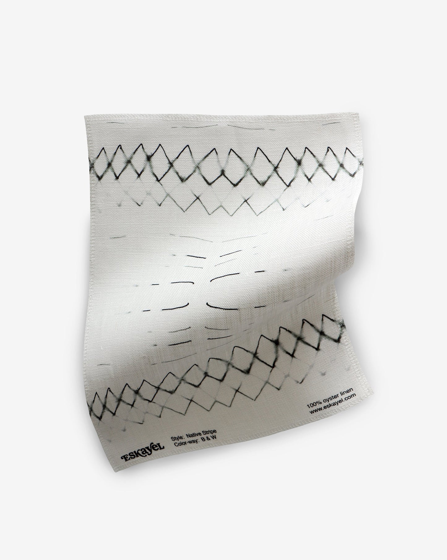 A Native Stripe Fabric Black + White piece of custom fabric with black lines on it, suitable for Native American textiles and interior schemes