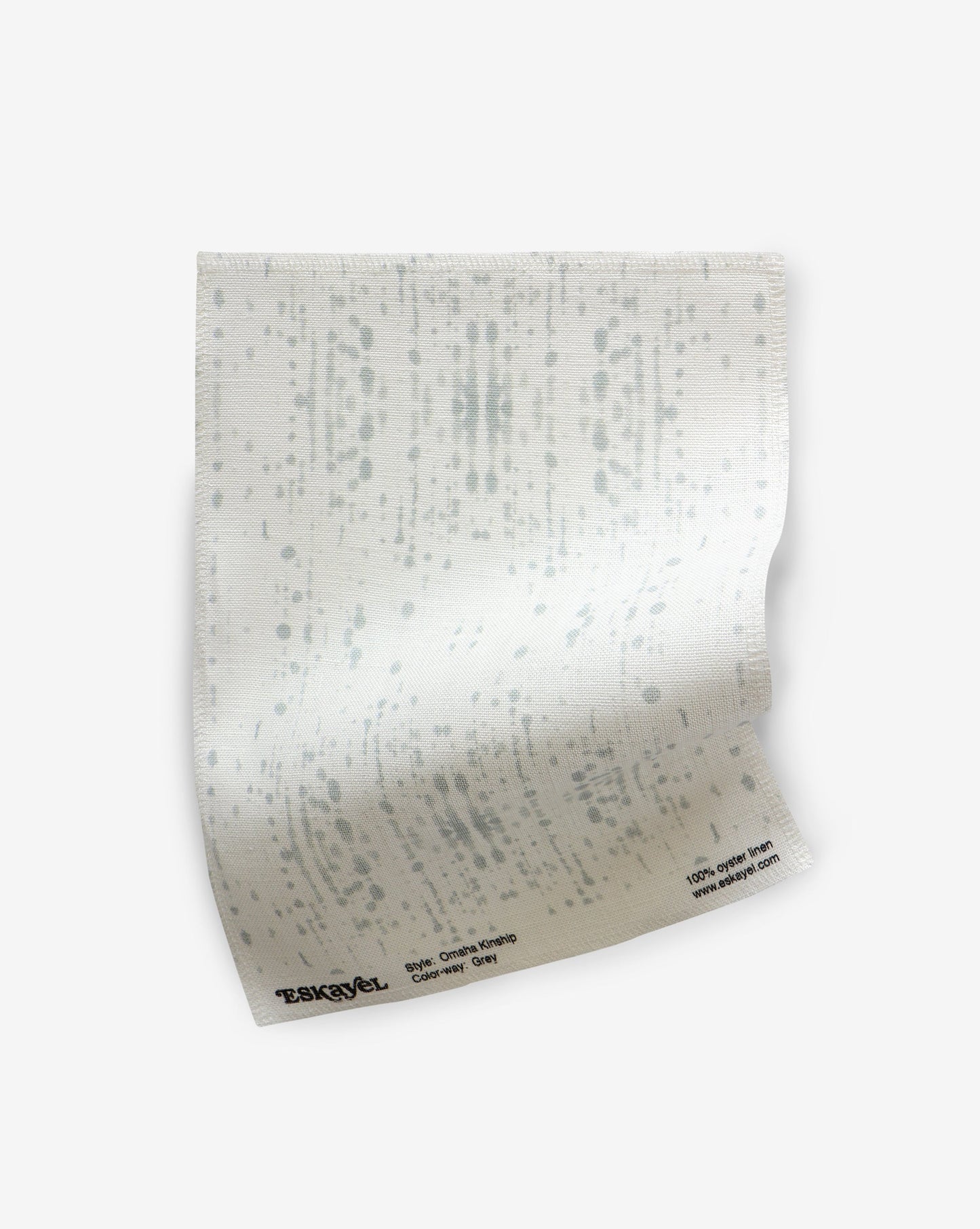 A white piece of Omaha Kinship Fabric Grey with dots on it is a common motif found in the artistic traditions of the Kwoma people of Papua New Guinea