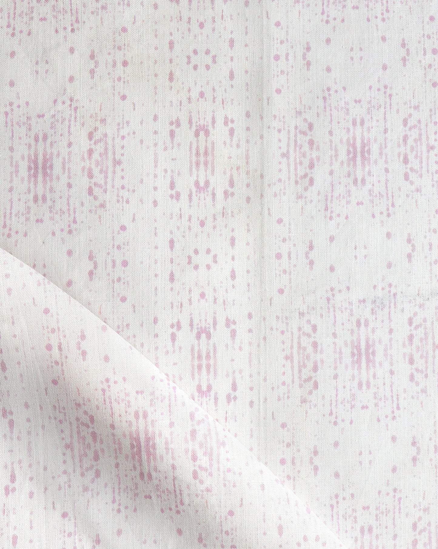 A pink and white Omaha Kinship Fabric with dots on it, in Eskayel's high-end Omaha Kinship pattern