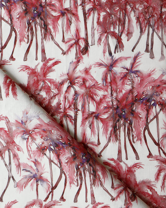A pink and purple luxury Palm Dance Fabric Persimmon with palm trees on it