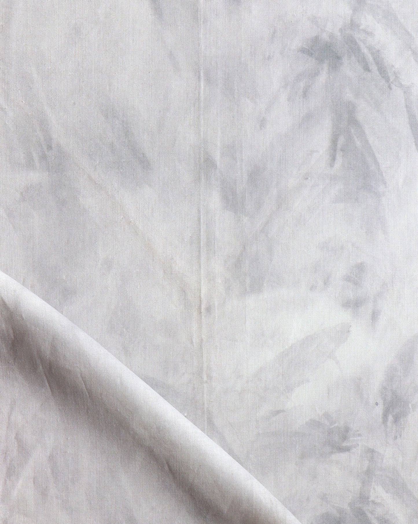 A close up of Palmeti Fabric with white paint on it, showcasing a fabric pattern