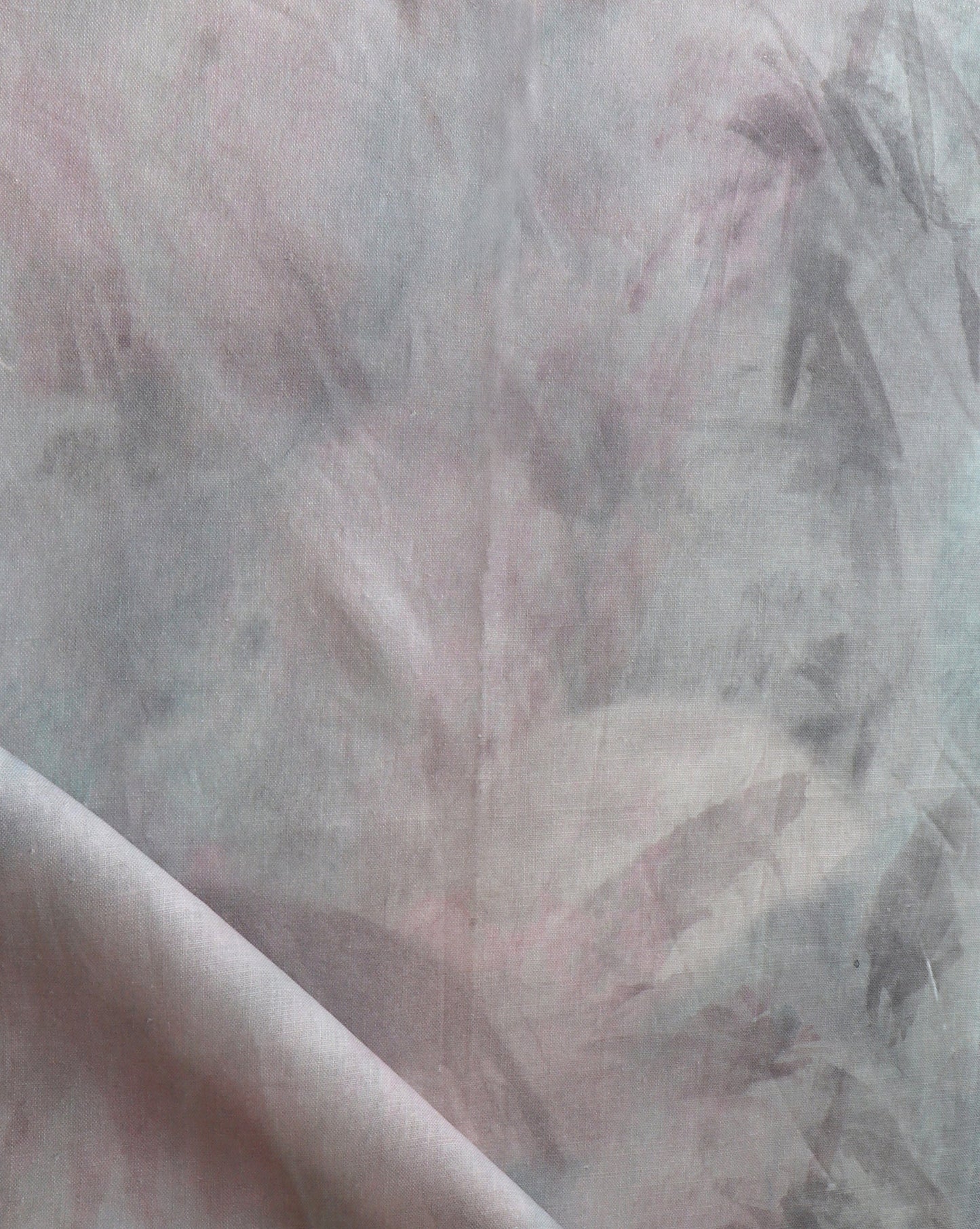 A close up of palmeti fabric in Aqua, featuring a pink and gray pattern