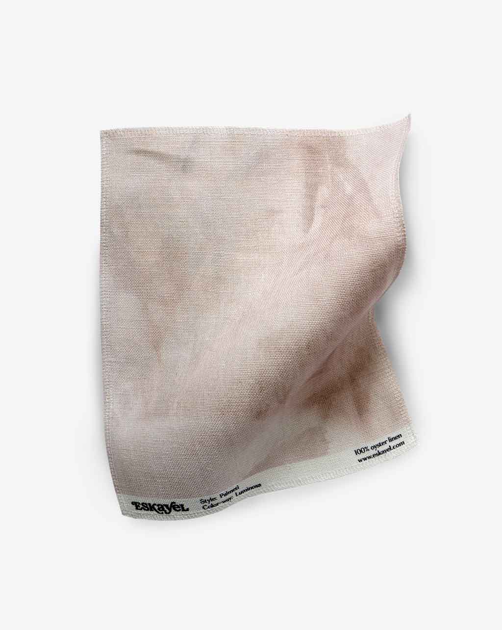 A Palmeti Fabric Sample Luminosa is placed on a white surface as a sample