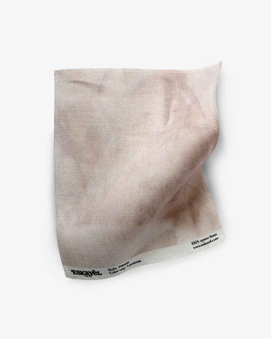 A Palmeti Fabric Sample Luminosa is placed on a white surface as a sample