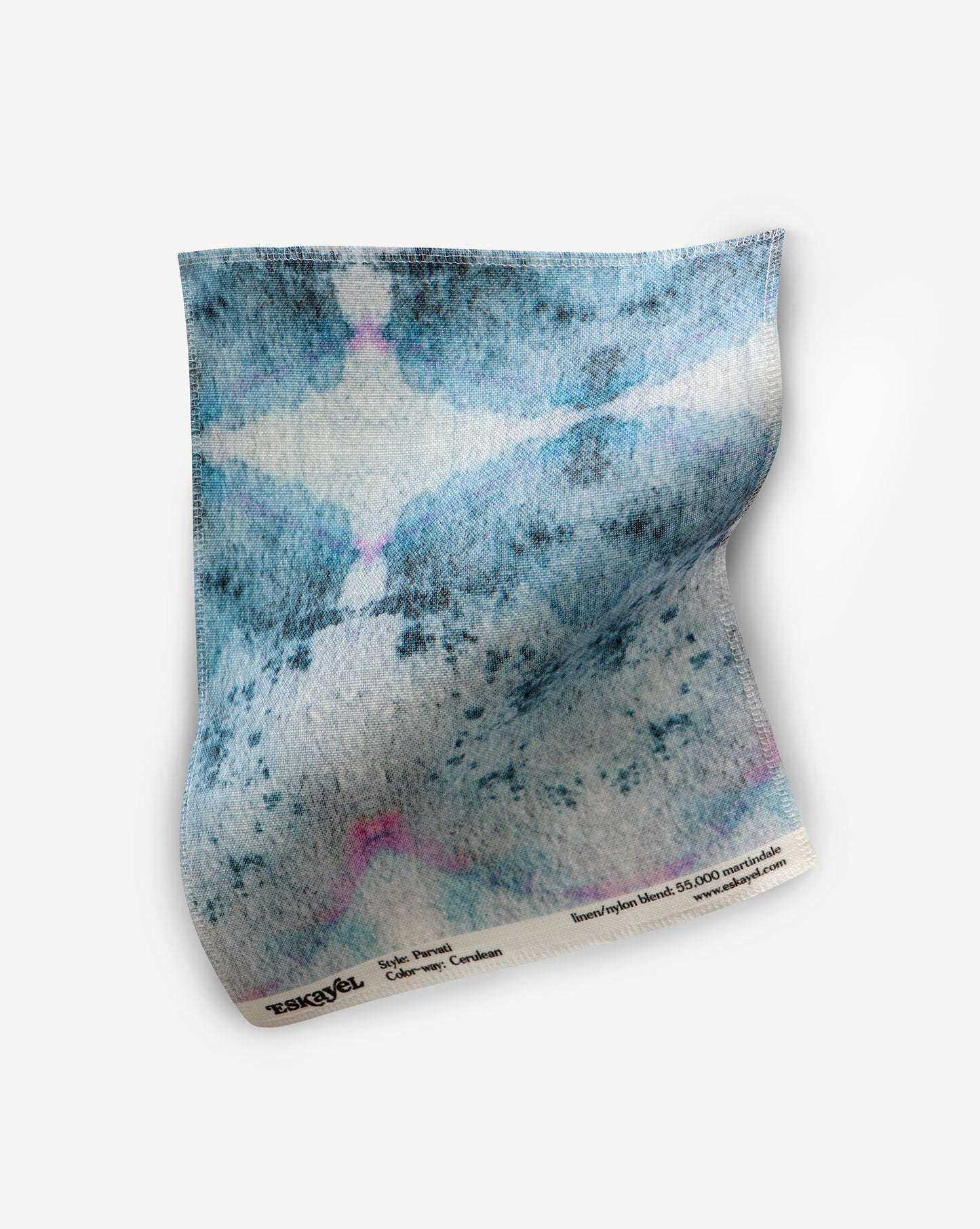 A Parvati Fabric Cerulean fabric with a pattern on it