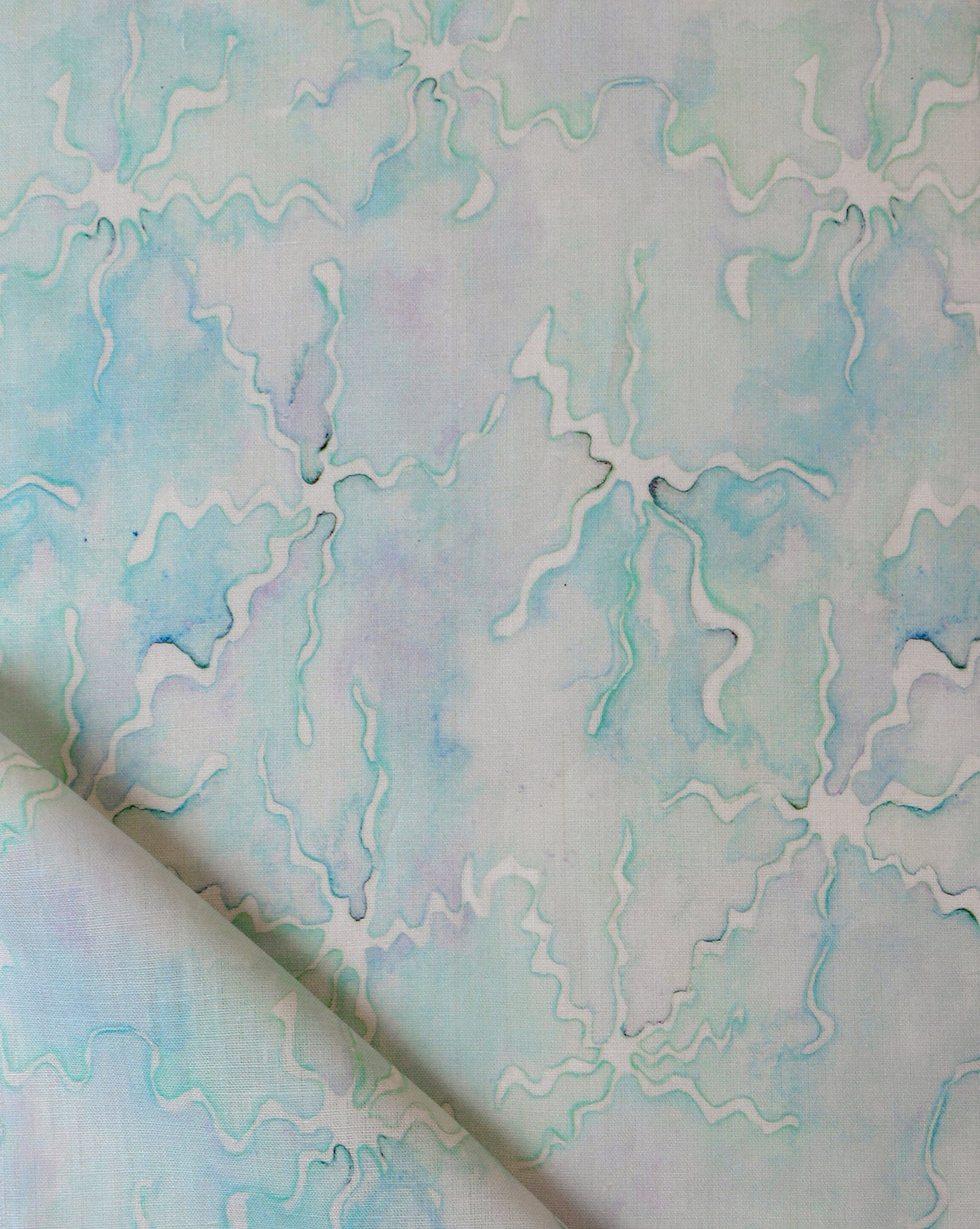 A piece of Pecosa Fabric with a blue and white pattern on it
