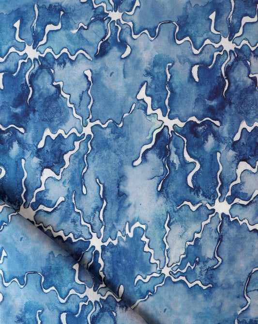 A blue and white pattern on Pecosa Fabric, using resist dye techniques for fabric design