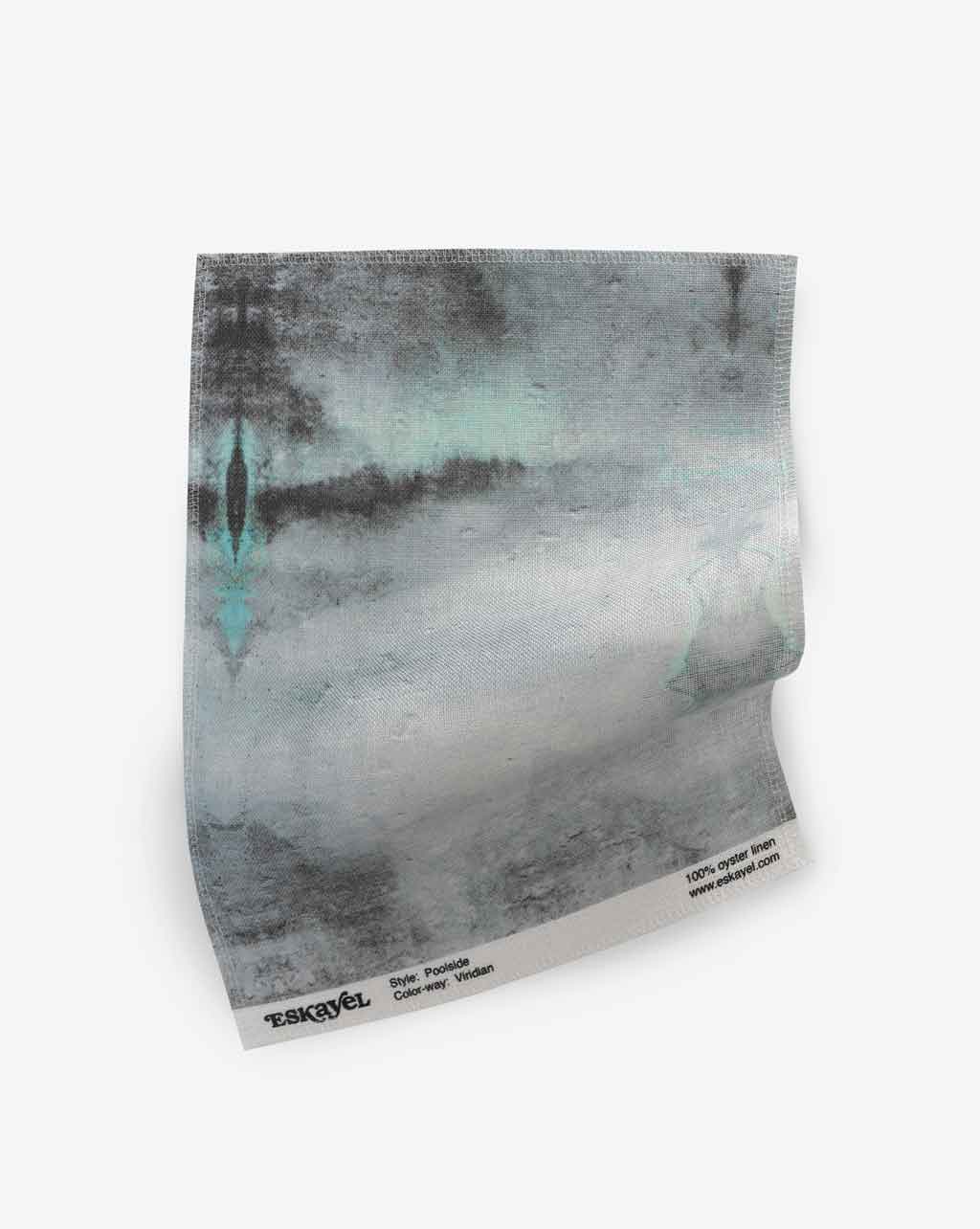 A luxury piece of Poolside Fabric Viridian with an abstract painting on high-end textiles