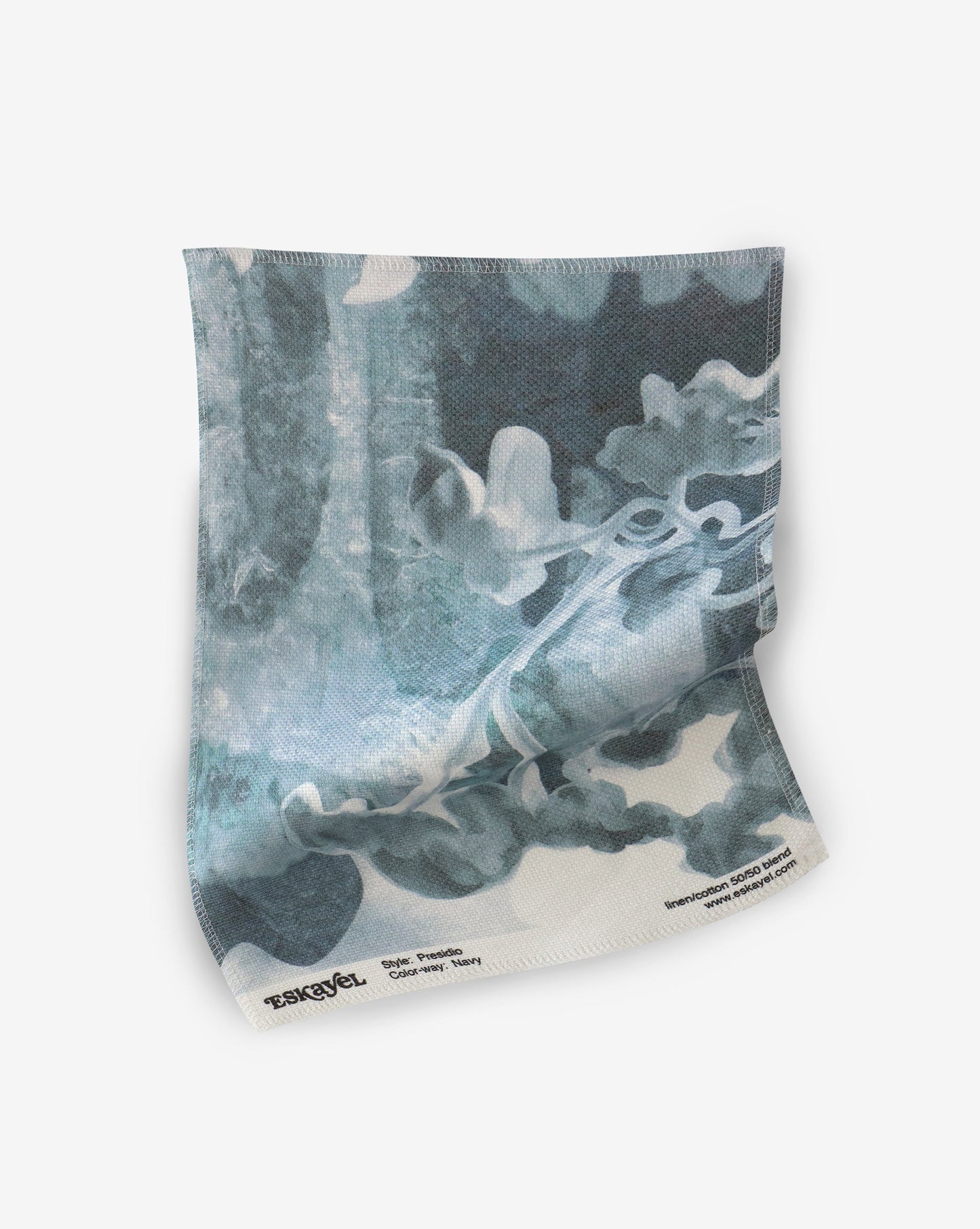 A blue and white Presidio Fabric Navy pillow from Eskayel on a white background