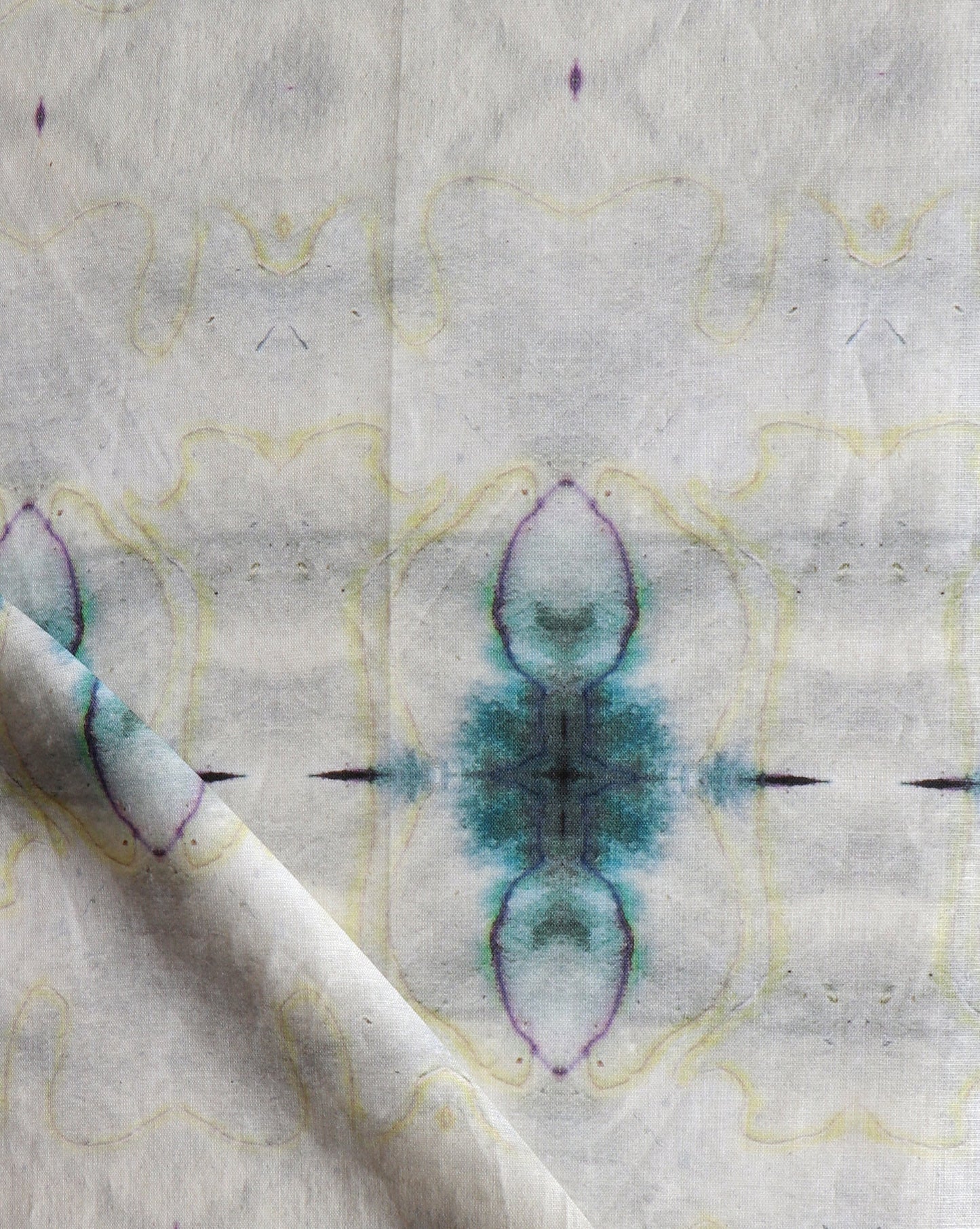 A close up of Pulsar Fabric Sand with blue and purple designs
