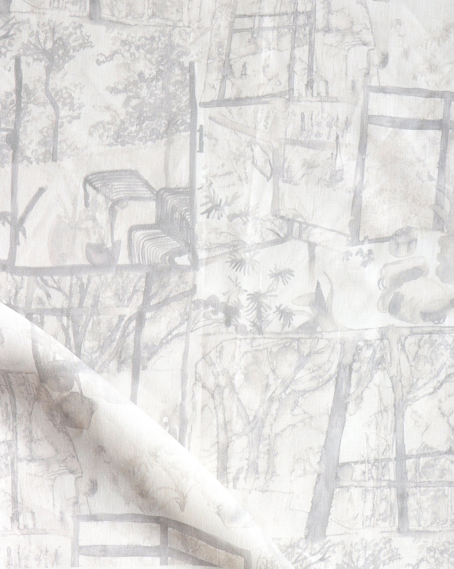 A white and grey Quotidiana Fabric Sand with a picture of a tree in neutral tones
