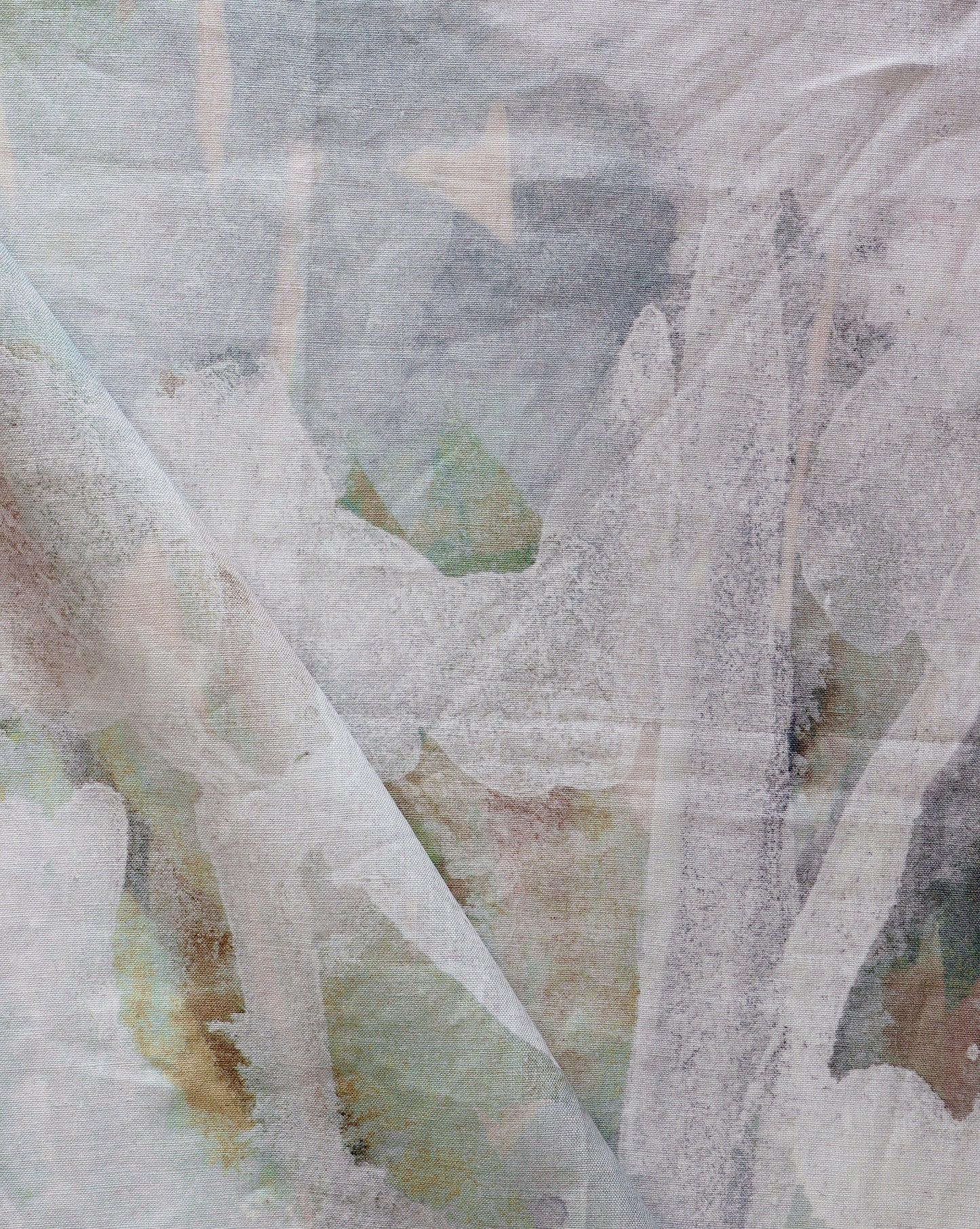 A close up of a Regalo di Dio Fabric Aqua painting on a piece of fabric