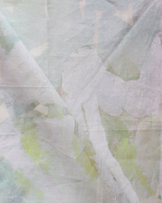 A close up of a Regalo di Dio Fabric Luminosa with a pale green and white pattern