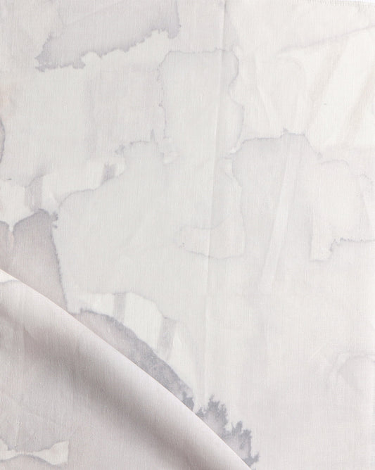 A close up of a Sea Galaxy Fabric Coral custom drapes with white paint on it