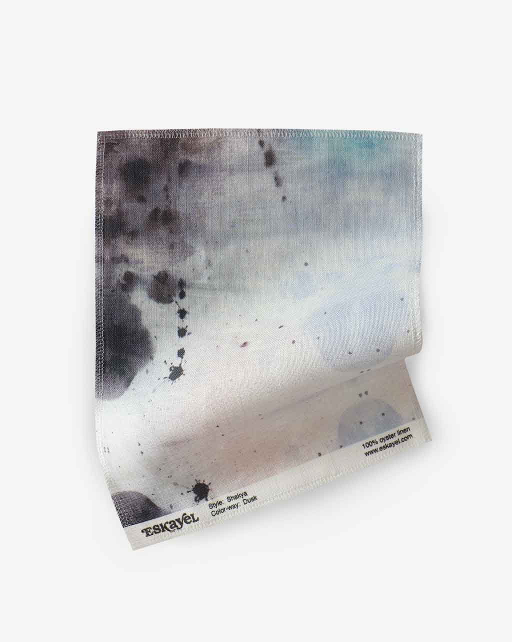 A piece of Shakya Fabric Dusk painted with watercolor on a celestial world