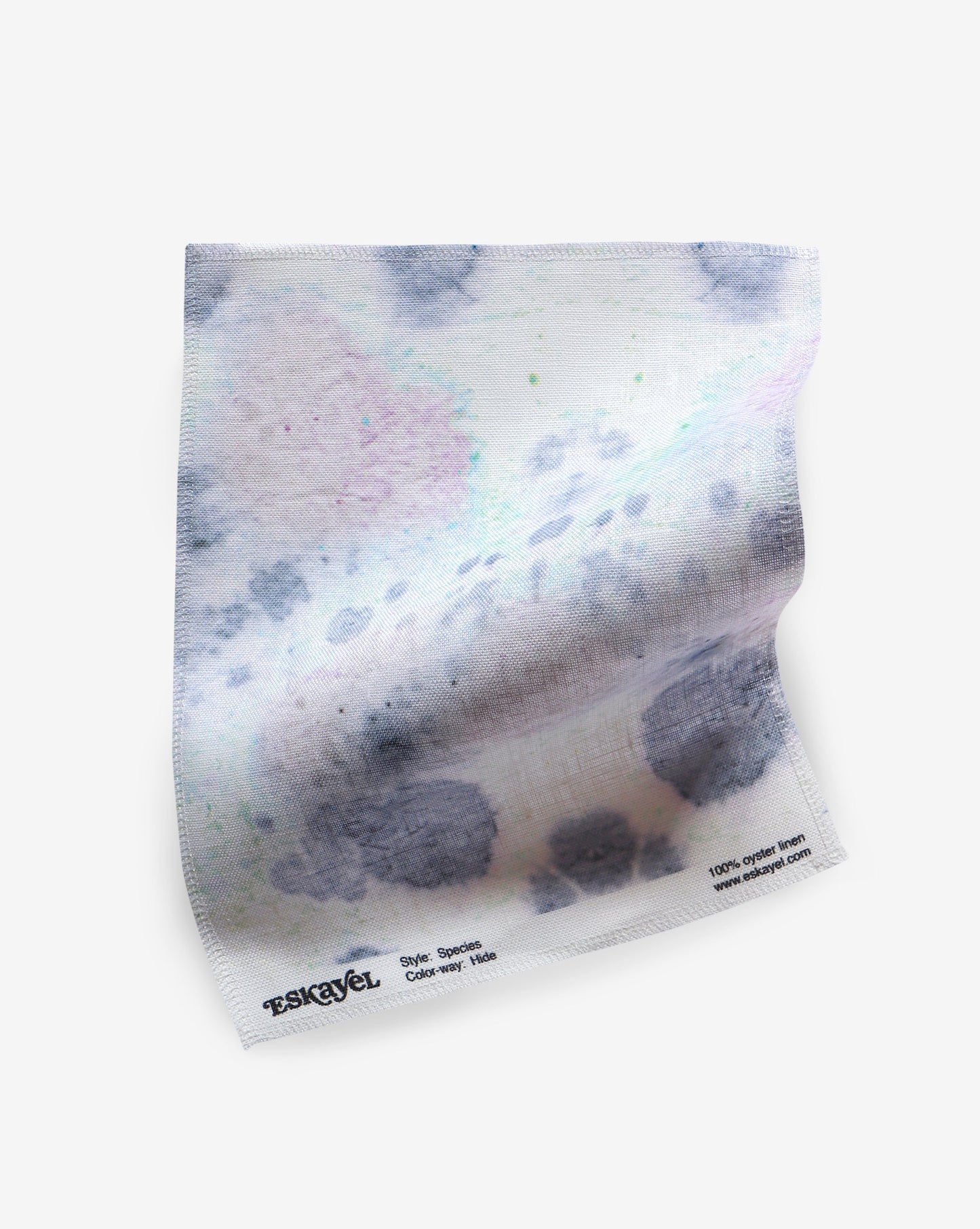 A piece of fabric with the Species Fabric Hide kaleidoscopic effect ink pattern on it