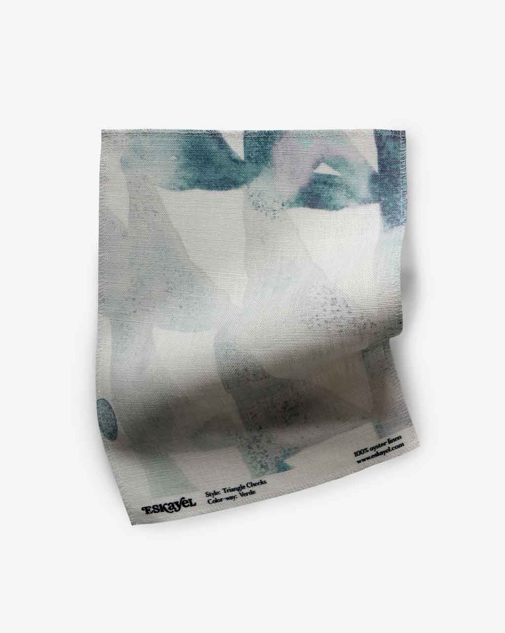 A luxury Triangle Checks Fabric Verde with a geometric pattern of triangle checks, in blue and white