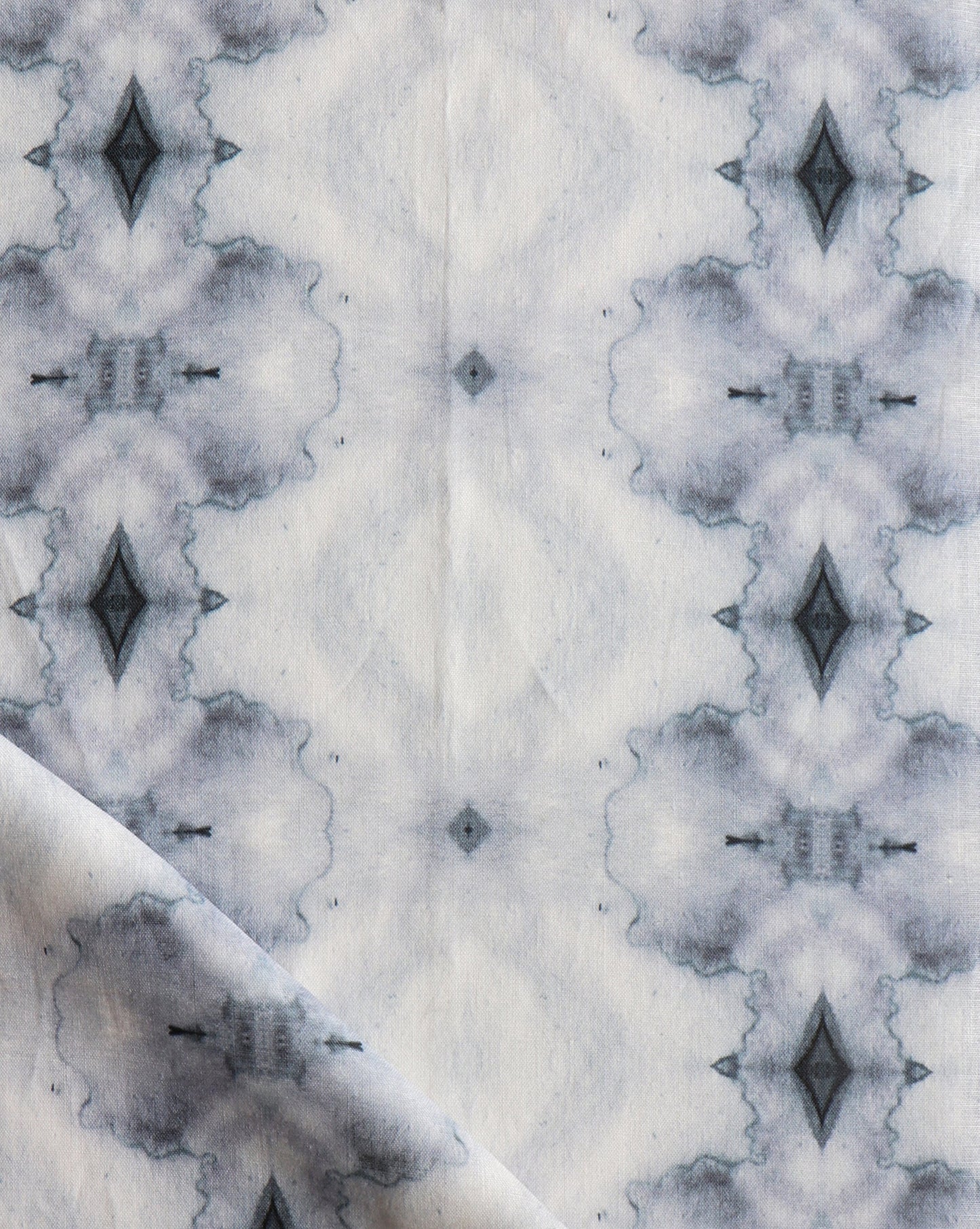 A close up of Twinkle Fabric Ocean from the Galaxy Collection with a black and white pattern