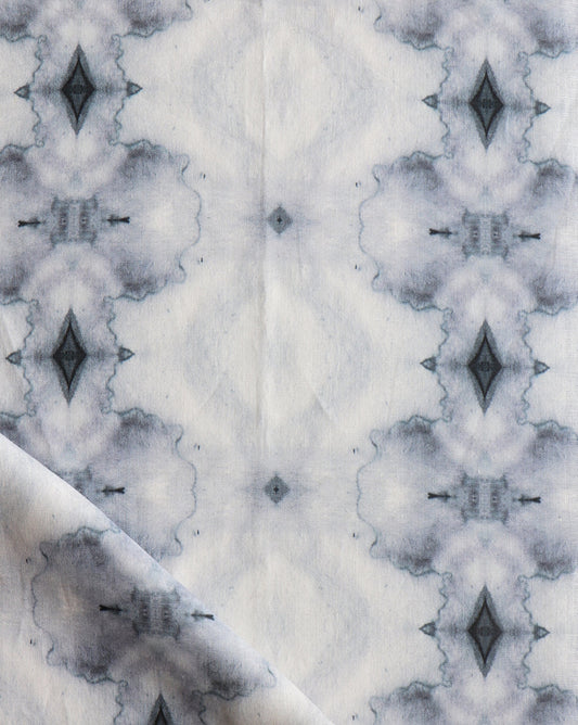 A close up of Twinkle Fabric Ocean from the Galaxy Collection with a black and white pattern