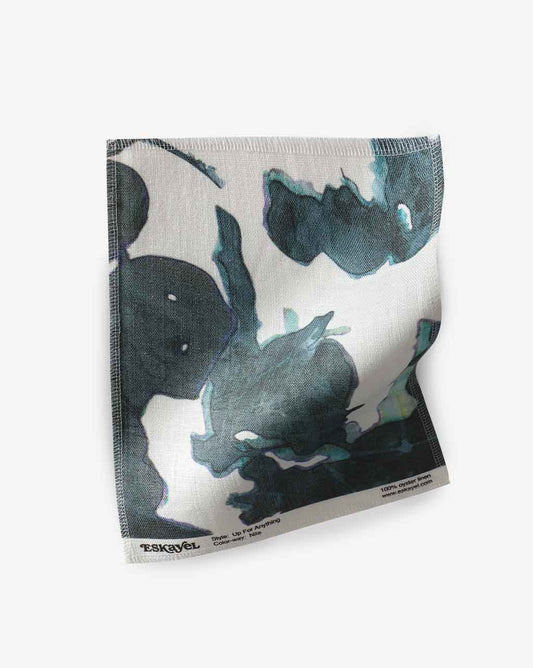 an Up For Anything Fabric Sample Nila with a black and blue design on it