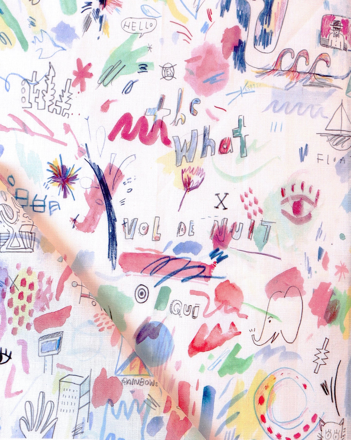 A piece of Vol de Nuit Fabric Multi with colorful writing on it