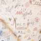 A piece of Vol de Nuit Fabric Sunshine with Eskayel drawings on it