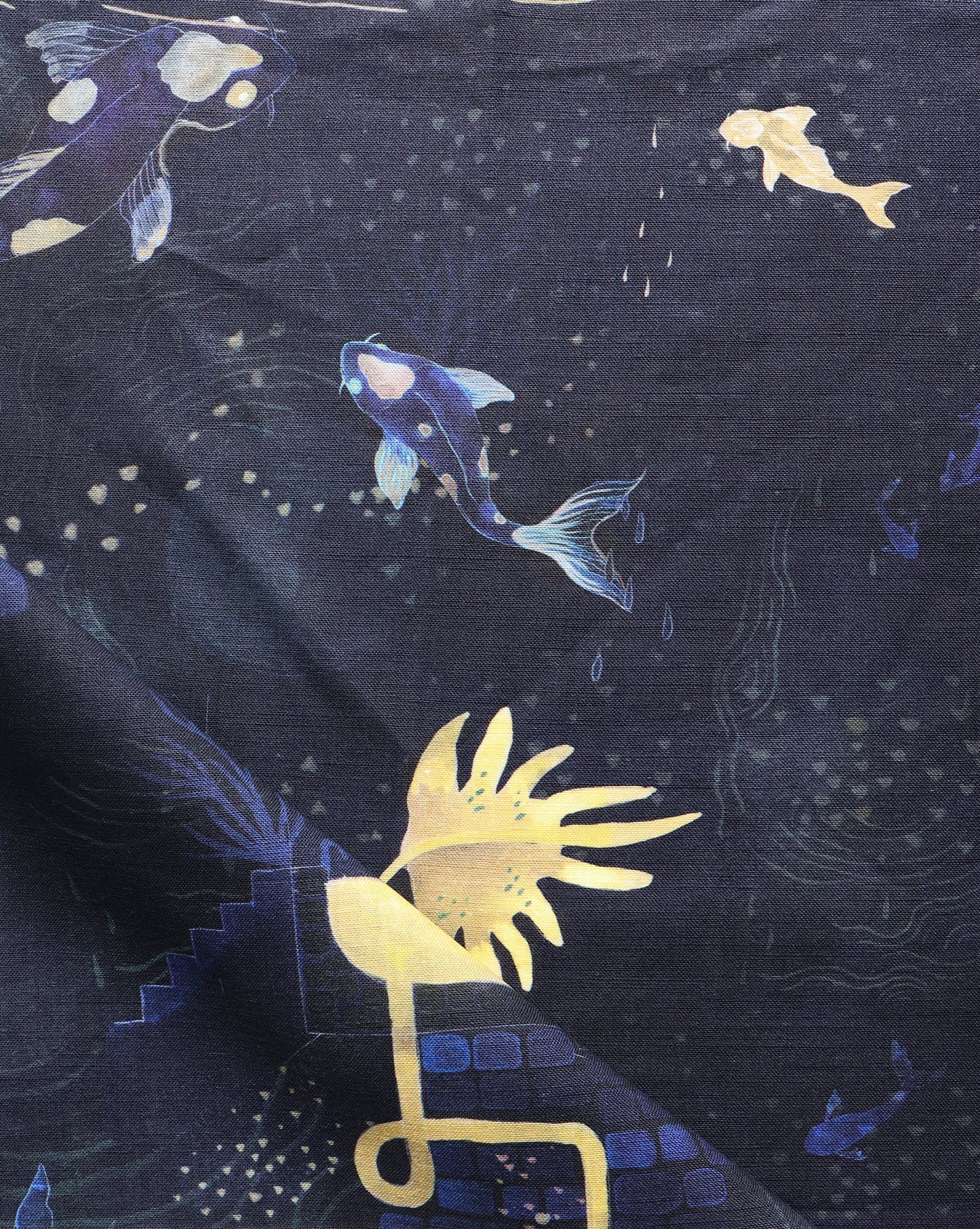 A close up of Water Signs Fabric Indigo with gold fish on it