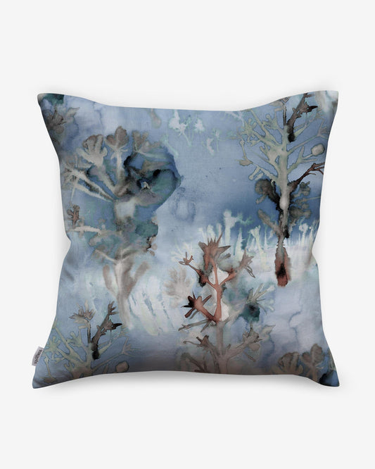 A blue and white pillow with trees on it The pillow features Emvasia and Aionas Pillow keywords as well as Thalassa Pillow