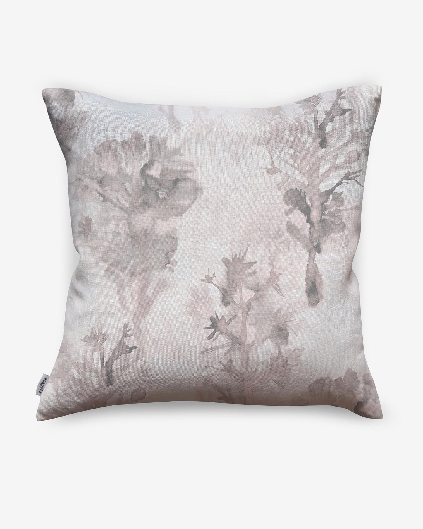 A luxury Aionas Pillow with a pink and white tree print