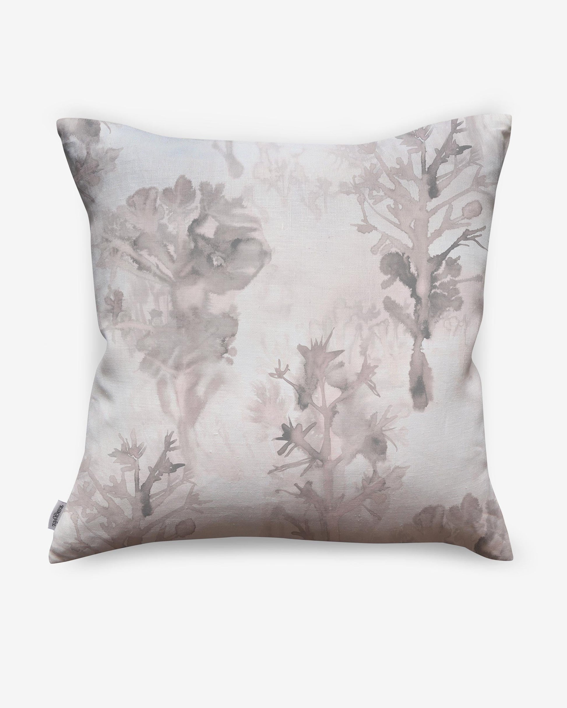 A luxury Aionas Pillow with a pink and white tree print