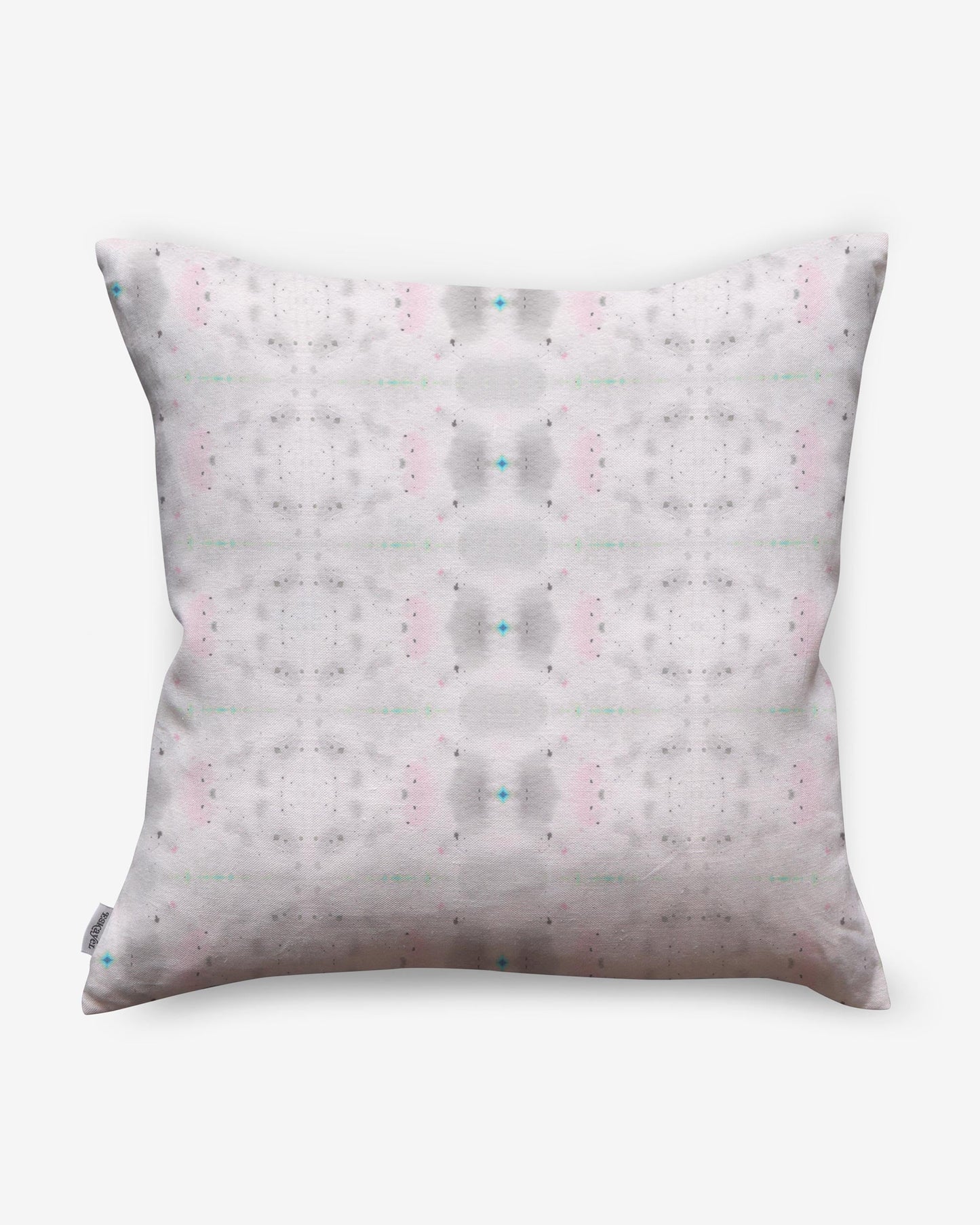 An Astral Pillow with a pink and white pattern from the Jangala Collection