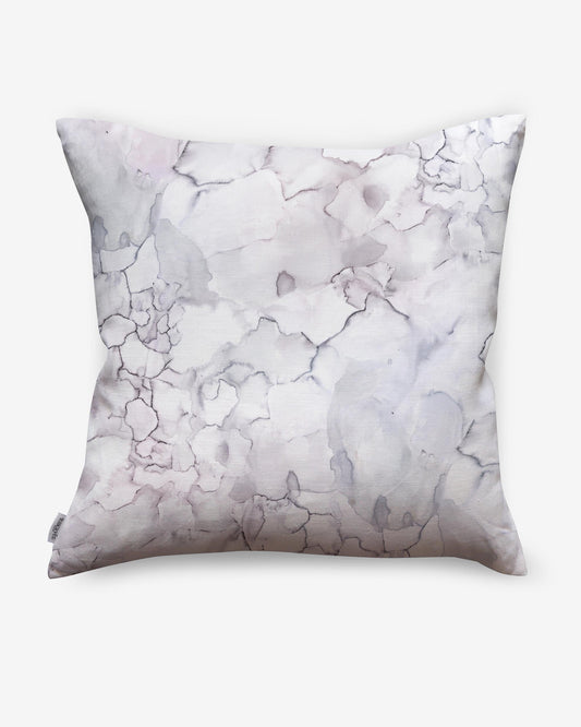 An Aquarelle Pillow Ice with a white and grey marble pattern, perfect for adding a touch of luxury to your bedroom