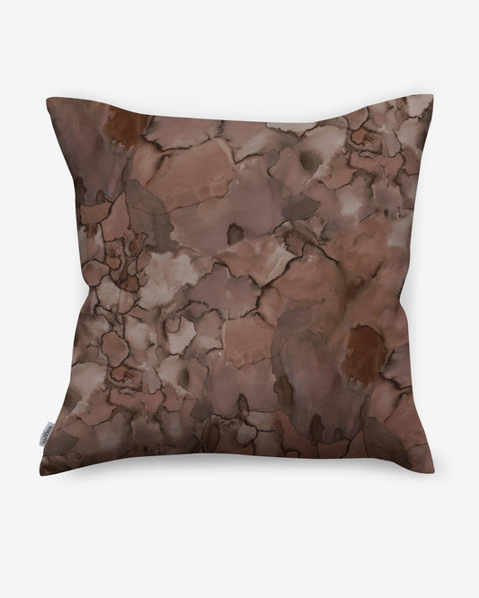 A custom Aquarelle Pillow with an Earth colorway pattern on it