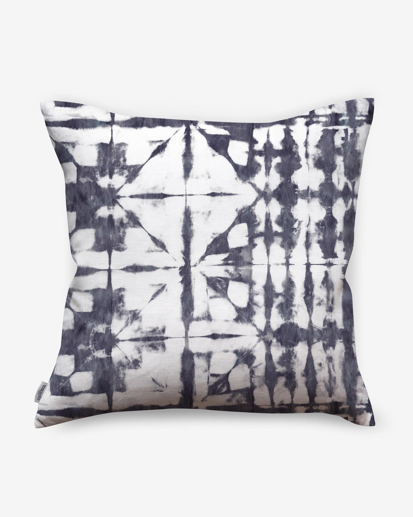 A Banda Pillow Midnight with a black and white shibori tie-dye design