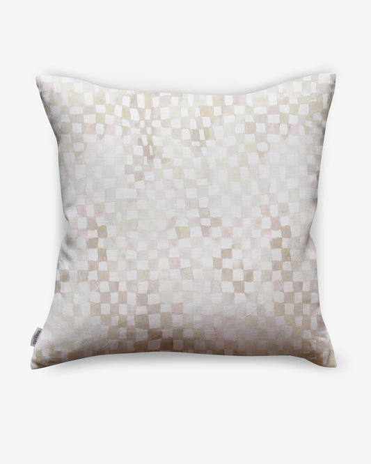 A white and checkerboard patterned Chess Pillow on a white background