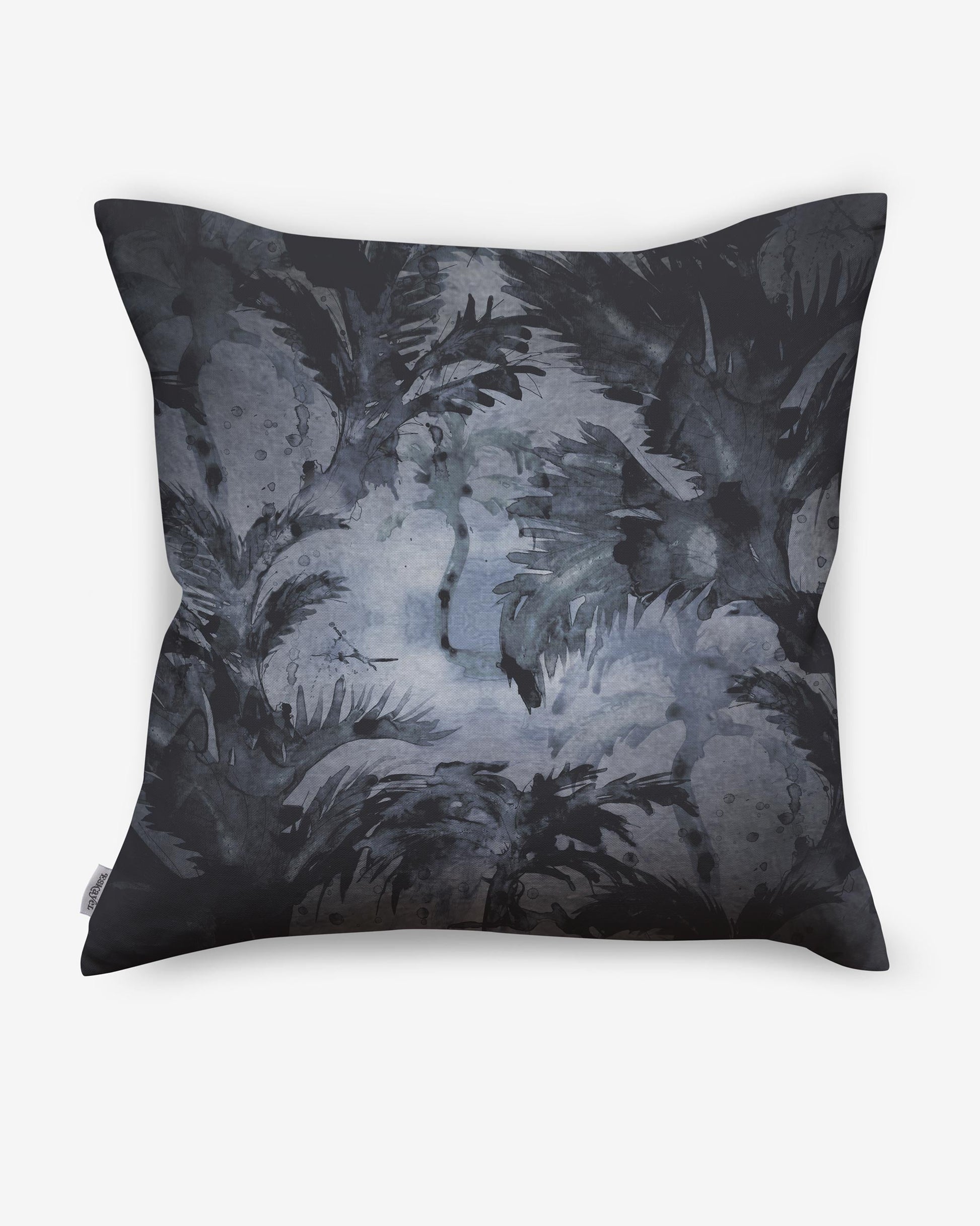 A Cocos Pillow Midnight with a black and white painting featuring Cocos palm tree motifs on it