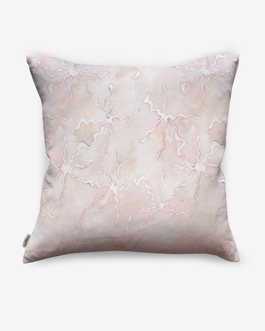 A Pecosa Pillow Light Peach, designed using resist dye techniques