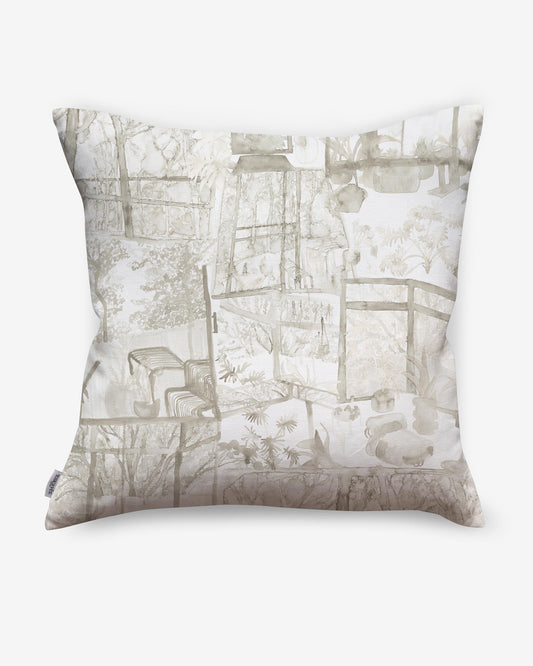 A high-end Quotidiana Pillow Sand with verdant views of a house and trees