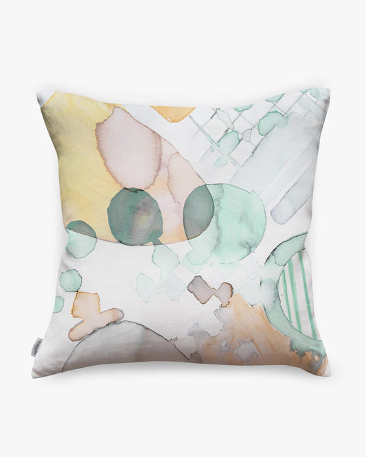 A Sea Galaxy Pillow with a watercolor painting and custom drapes on it