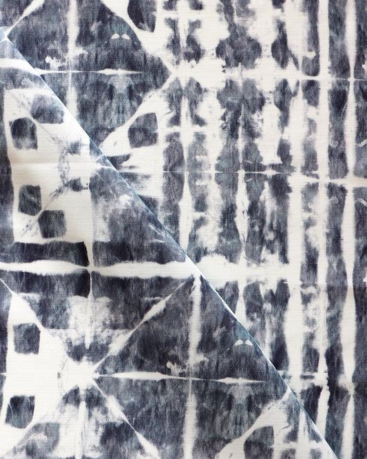 A close up of a blue and white tie dyed fabric, perfect for Banda Performance Fabric Midnight or luxury performance fabric