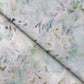 A close up of a Cortile Performance Fabric Verde with a Verde green and white floral print