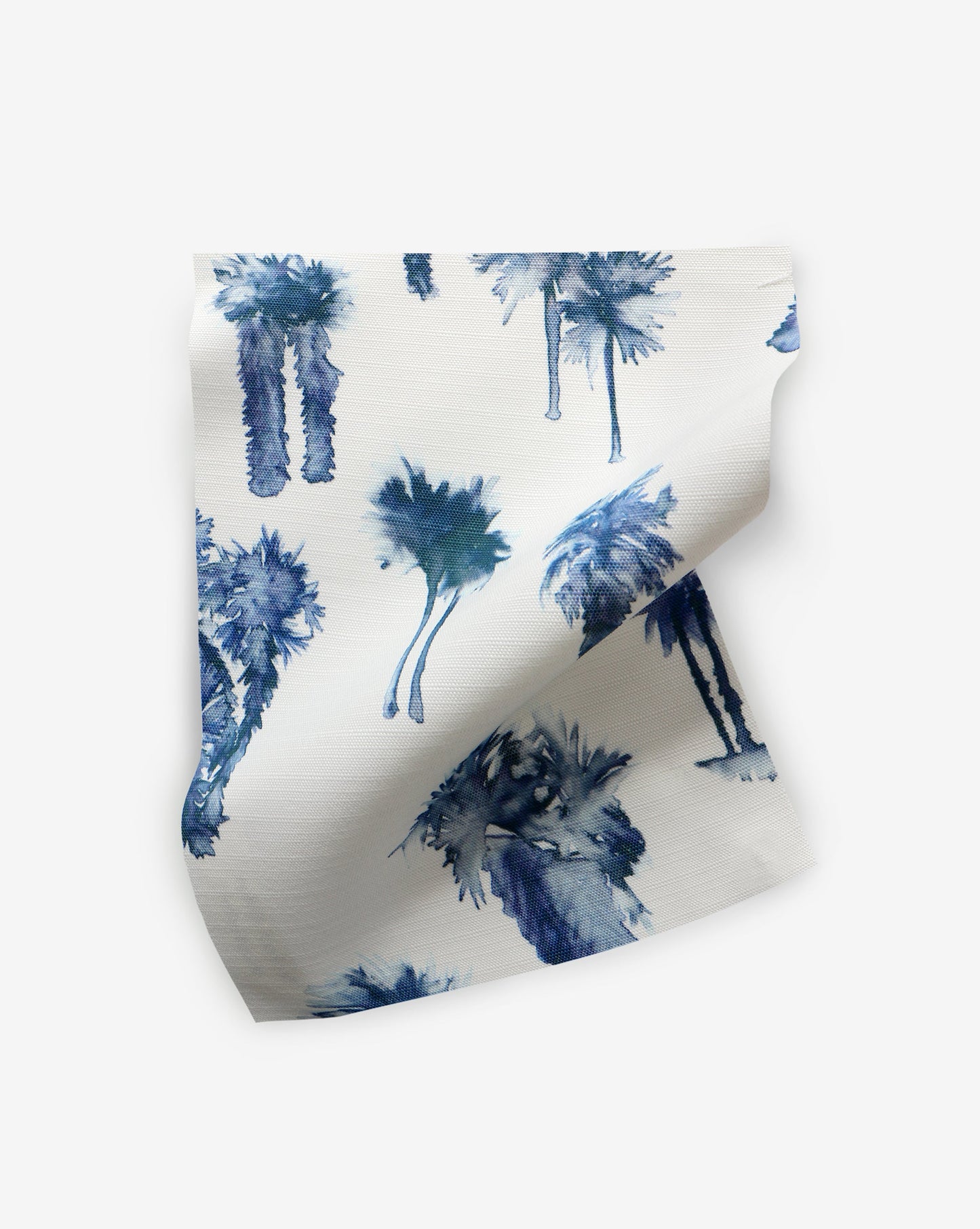 A blue and white Perfect Palm Performance Fabric with a hint of Midnight on it