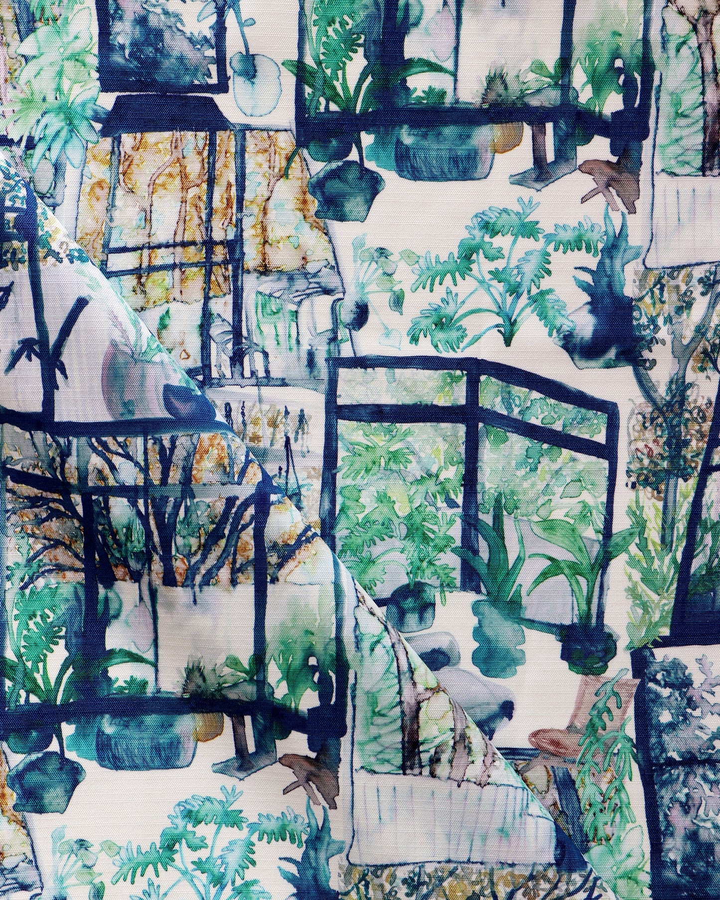A luxury performance fabric with the Quotidiana Performance Fabric Twilight pattern, featuring verdant views of plants and trees