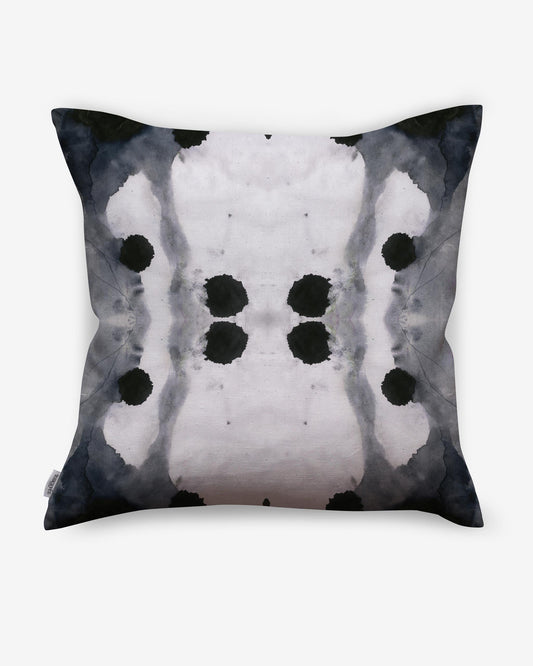 A black and white Dynasty Outdoor Pillow Indigo with an ink blot design