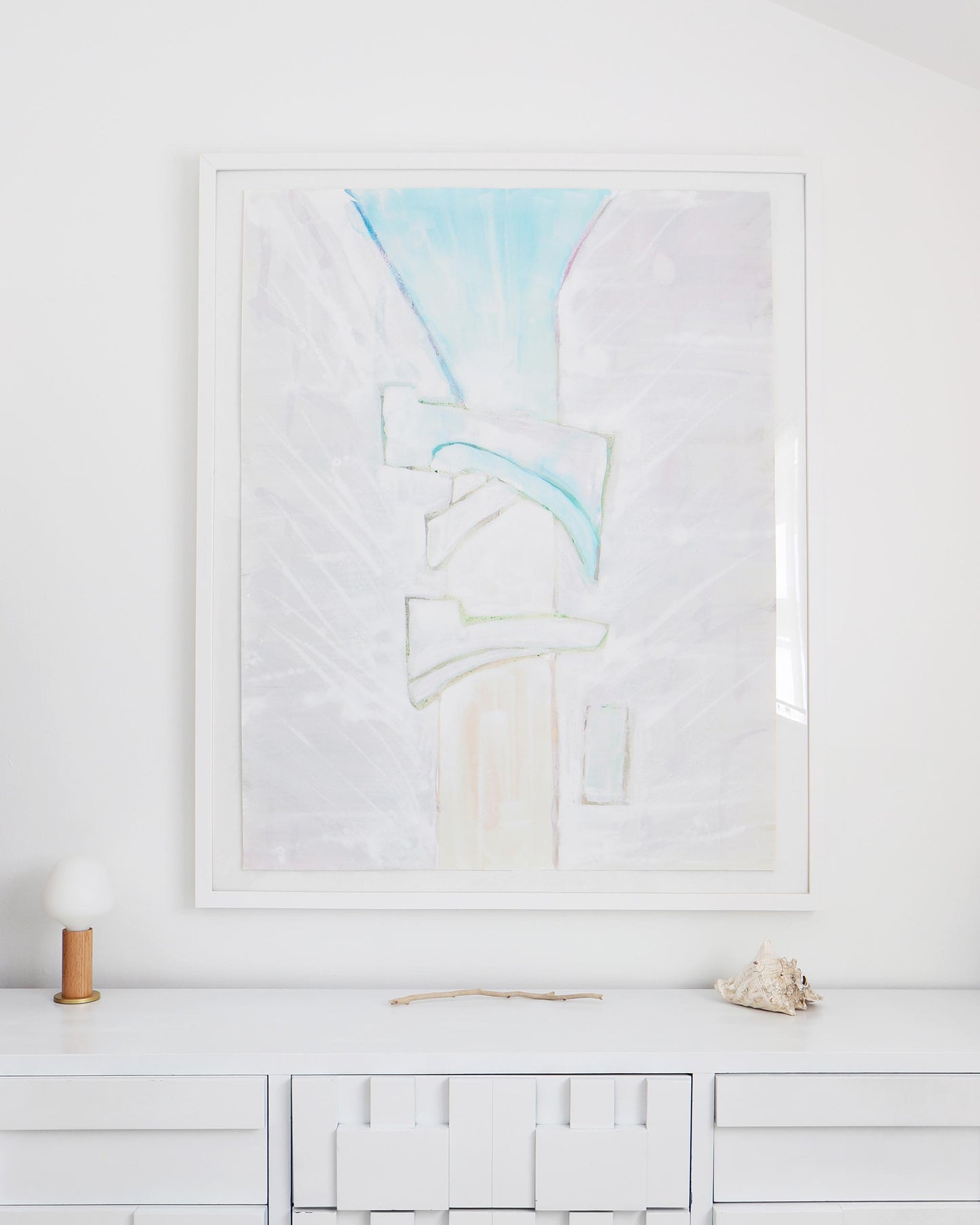 A white Sky Arc Print dresser with a painting by the Eskayel founder above it